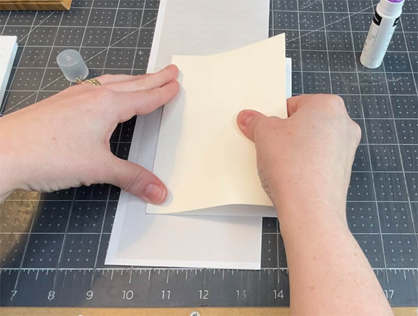 press the ivory sheet into place, lining up the top and bottom